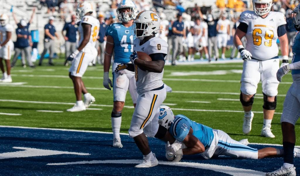 UTC's Ailym Ford drags a Citadel defender into the end zone
