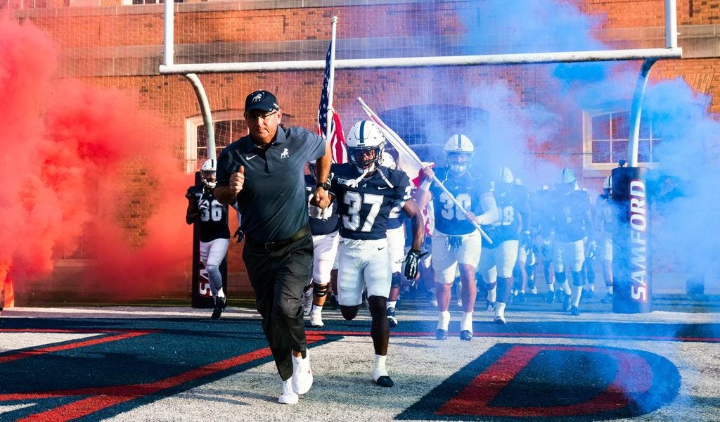 Samford football running out of the tunnel